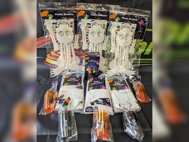 Lot 112-0517-23B-1 - Lot of (5) 4 pak Halloween themed shot glasses, (3) Plasctic hanging skeletons, (3) Halloween themed...