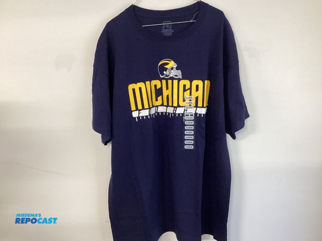Lot 2-19208 - New University of Michigan Football t-shirt by Pro Edge. Maize and Bluetooth. Men’s size XL