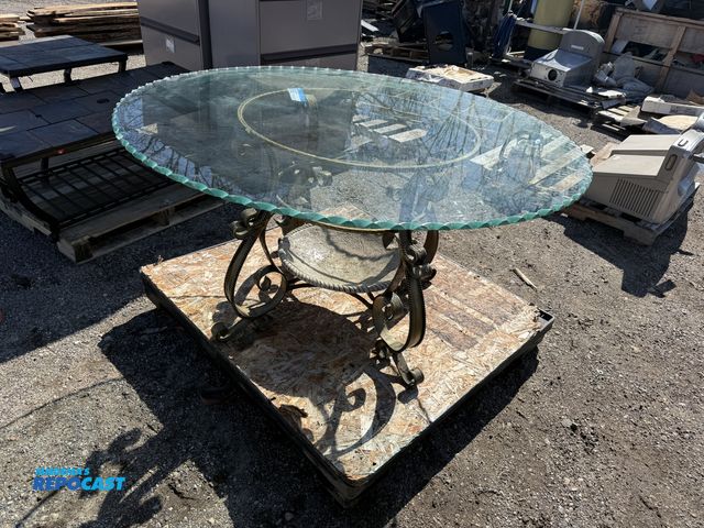 Lot 2-95092 - Large Circular Patio Table with Intricate Metal Base and Glass Top - Some Damage