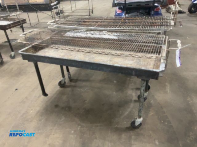 Lot 2-33689 - (2) Used 5’ Charcoal Grills, on casters, 24”x60” grill area, come with extra grate, showing wear/dam...