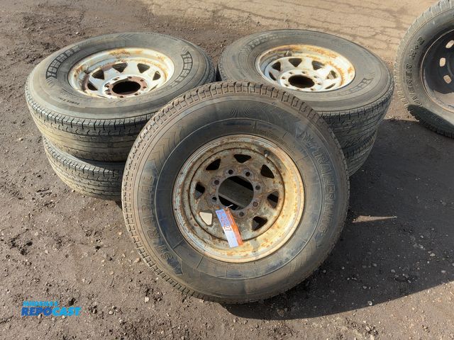 Lot 2-42427 - Lot of (4) Used Towmax Size 235/85R16 Trailer Tires on Steel 8-lug Wheels, two are missing valve ste...