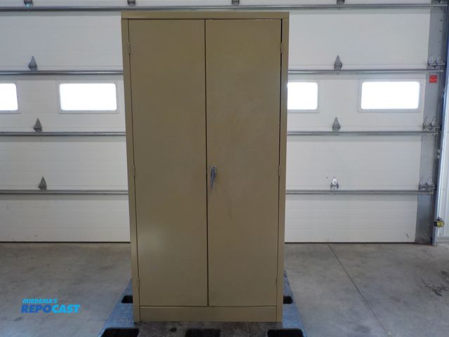 Lot 2-34097 - Two drawer metal storage cabinet. Four adjustable shelves. 36" w x 24"d x 72" h