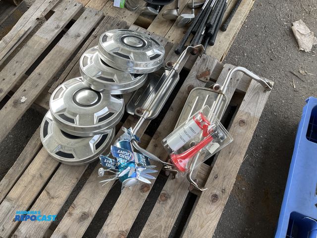 Lot 2-67613 - (4) 11.5” diameter center caps, (2) side mirrors, a Bud Light can airplane, and a emergency horn