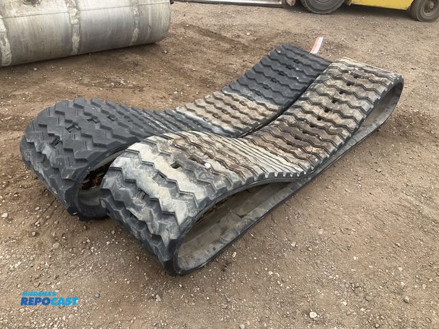 Lot 2-43275 - Caterpillar rubber skid steer tracks p/n 584-7123, 450x86x56, used
