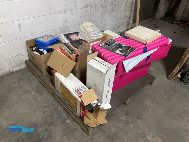 Lot 2-19645 - Skid lot of miscellaneous toys including: movies, porcelain dolls, Star Wars book tape, books, tradi...