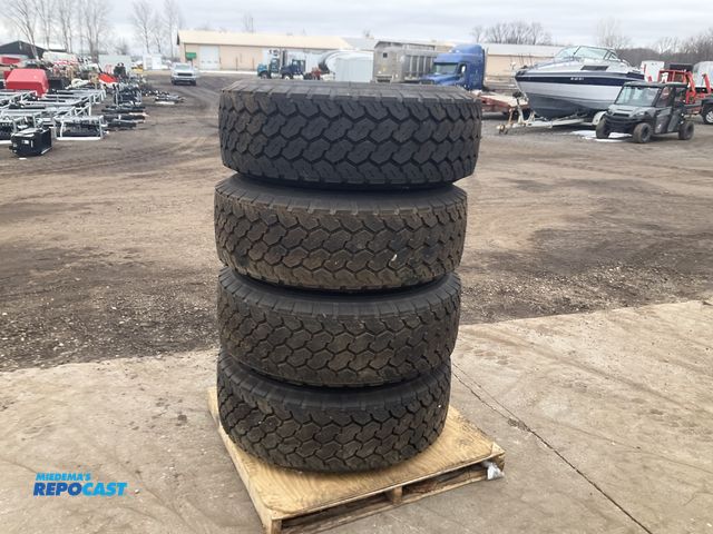 Lot 2-11581 - (4) 385/65R22.5 semi tires on steel 10-bolt wheels