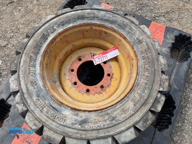Lot 2-72711 - 1 Unused Titan H/E skid steer tire on 8 lug rim, size 10-16 NHS