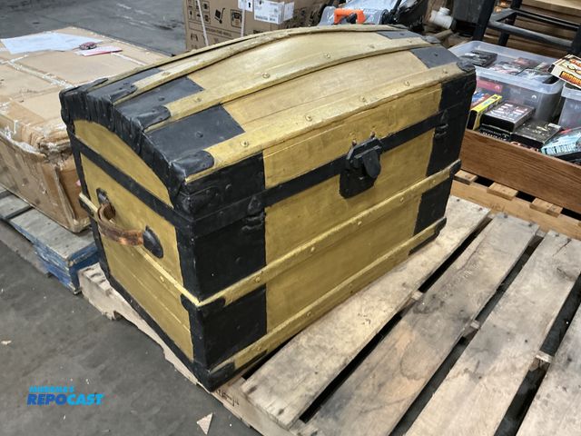 Lot 2-64129 - Antique wooden chest painted black and gold with leather handles on side 32” x 19” x 22”
