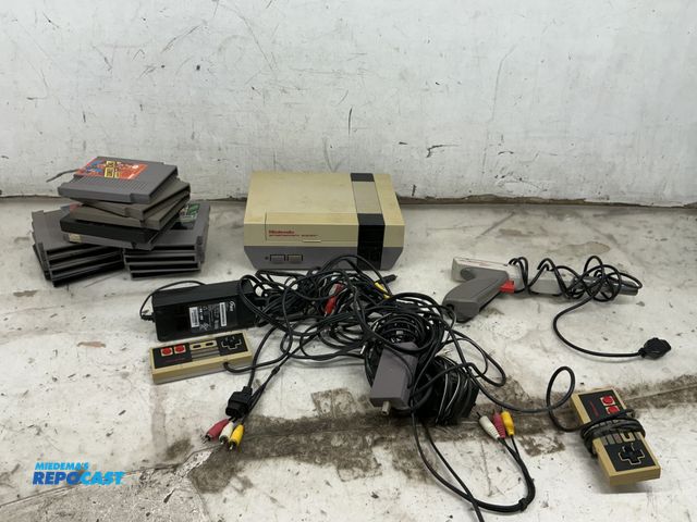 Lot 2-75400 - Vintage Nintendo Entertainment System model #NES-001, Nintendo Zapper, Controllers, and various Nint...