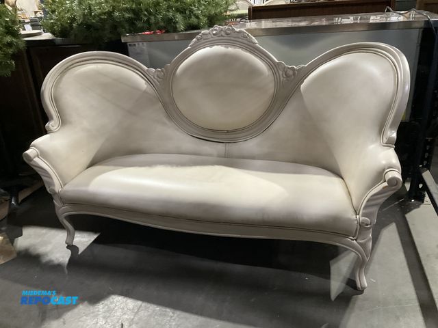 Lot 2-55028 - Cream Victorian Syle Settee Cream colored Victorian style settee with ornate wood carving on back, a...