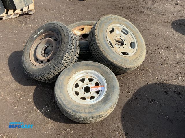 Lot 2-42428 - Lot of (1) Cooper Size 265/70R17 Tire on Steel 8-lug Wheel off a 06 Dodge, (1) Bridgestone Size 245/...