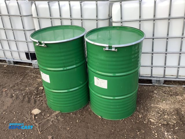 Lot 2-19308 - 2 55 gallon green steel barrels with removable lids and locking rings, clean inside, contained apple...