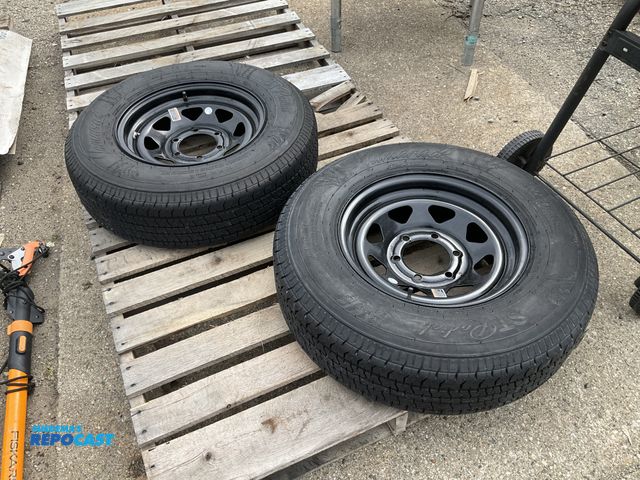 Lot 2-34904 - (2) barely used tires Tamarack Special Trailer (ST) Radial tires/wheels. ST225/75R15.