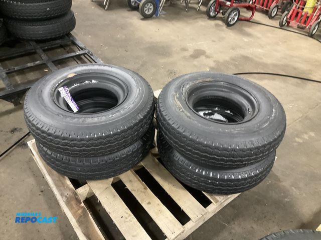 Lot 2-33503 - (4) 8-14.5 tires on steel mobile home style wheels, used