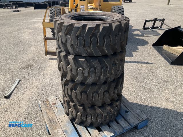 Lot 2-61991 - 4 Skid Steer Tires Wide Wall H.D. Rim Guard size 12-16.5