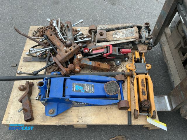 Lot 2-55609 - Skid lot of assorted garage items including: floor jacks, tire irons, chains and some truck hitches....