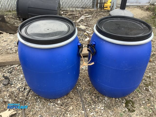 Lot 2-99961 - (2) 25gal. blue plastic barrels w/ removable lids and locking rings - clean inside, contained a food...