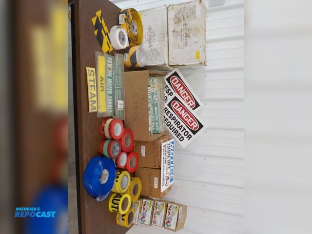 Lot 2-34072 - Industrial labels. Caution tape. Mighty line tape.