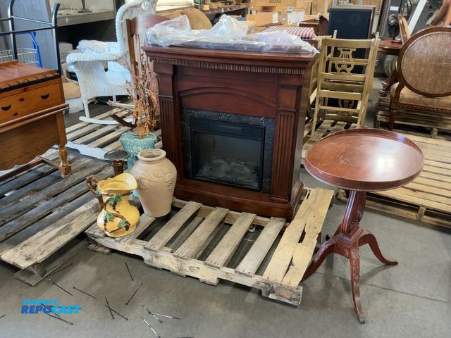 Lot 2-74951 - Wooden electric fireplace, wooden oval side table, &amp; (5) decorative vases/pitchers/stands.