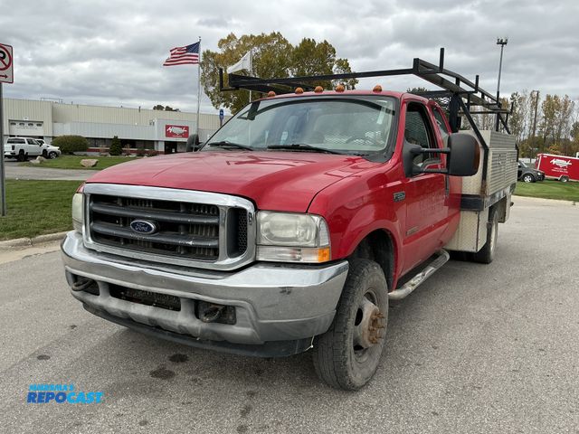 Lot 2-69303 - 2004 Ford F-350 XLT Extended Cab Flatbed Pickup Truck 4x4