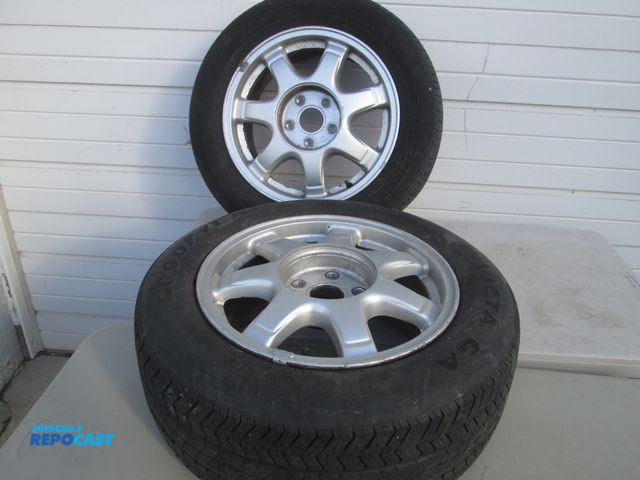 Lot 2-56911 - 2 tires mounted on lexus wheels p215/gori6 one is goodyear invicta ga one is michelin x6ta p215 gor
