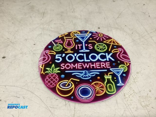 Lot 2-76349 - “It’s 5 O’Clock Somewhere” circular metal tin sign approx. 8”