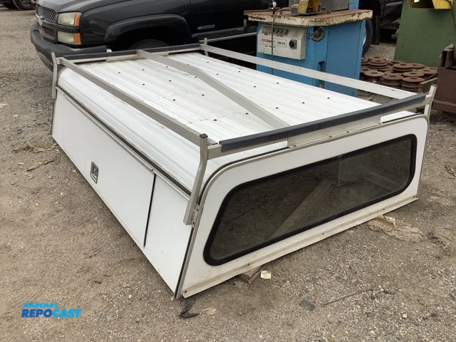 Lot 2-69102 - Truck topper with exterior storage compartments, measures approximately 97” long by 60” wide