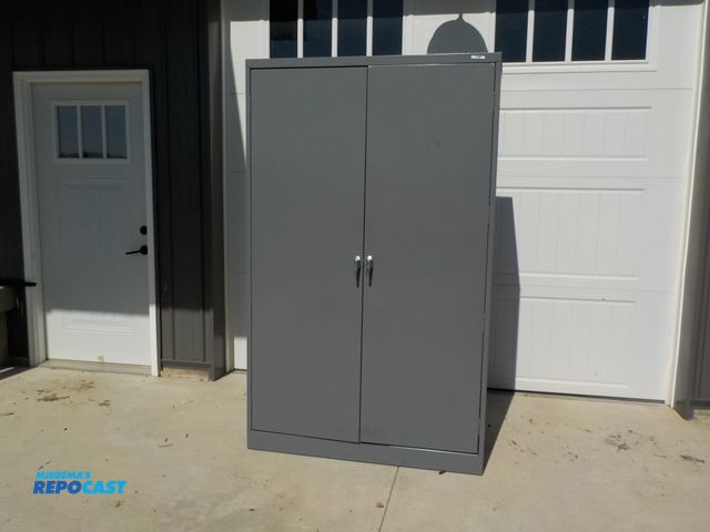 Lot 2-34114 - Commercial U-Line metal two doors storage cabinet. Three adjustable shelves.  48" w x 24"d x 78" h.