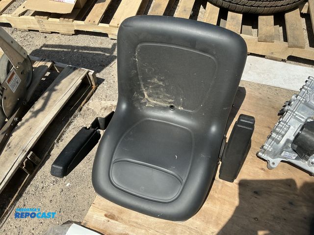 Lot 2-76854 - Black cushioned lawn mower seat