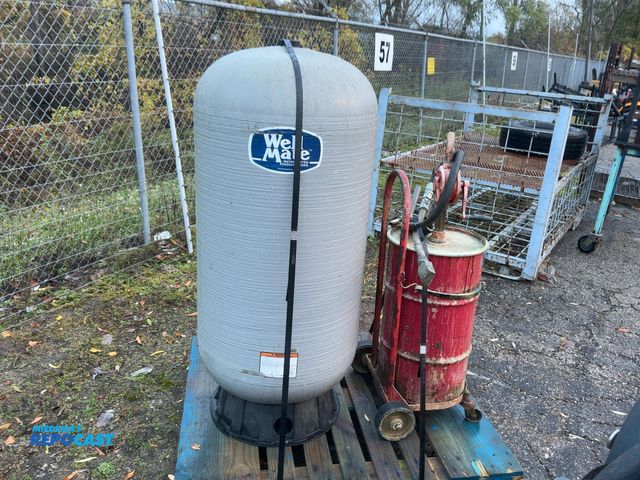 Lot 2-23800 - Well mate fiberglass water system pressure tank, and a old oil tank with pump