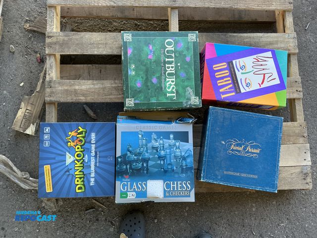 Lot 2-55602 - (5) board games. Glass chess set, Drinkopoly, Taboo, Outburst and Trivial pursuit. All proceeds go t...