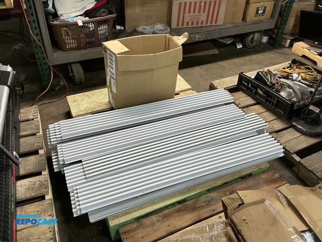Lot 2-77970 - Skid lot of approx. 48”x8” aluminum side panels and a box of various hooks/hangers