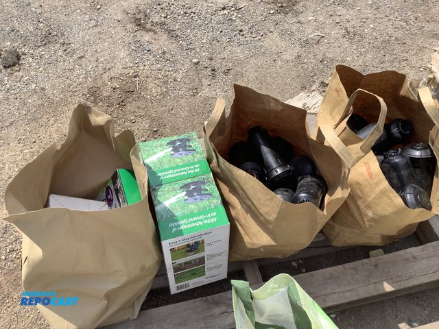 Lot 2-91020 - Lot of assorted irrigation items including: in ground sprinklers, toro stream sprinkler heads, indoo...