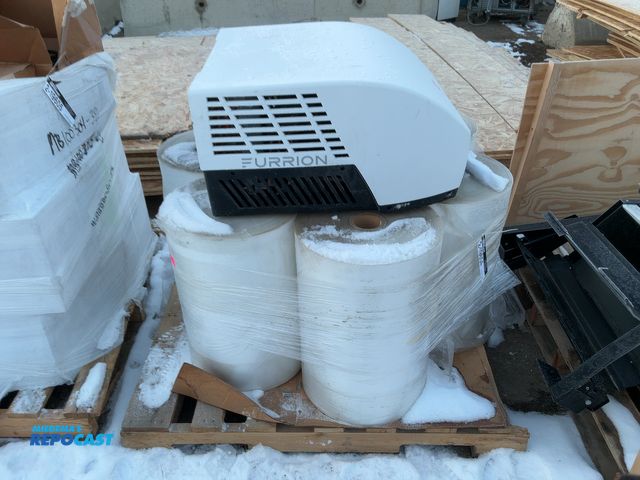 Lot 2-19604 - Skid lot including (6) plastic rolls (23” wide 2.5mil) and a Furrion RV A/C unit.