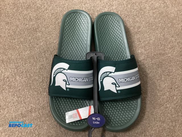 Lot 2-76597 - New Michigan State Spartans slides by FOCO. Officially licensed collegiate products. Men’s size 13-1...