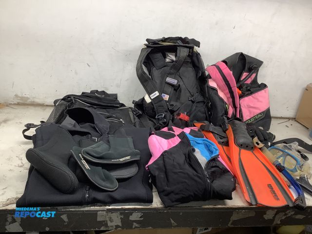 Lot 2-75571 - Lot of various scuba diving equipment including (2) wetsuits, snorkels, goggles, (2) scuba packs, a ...