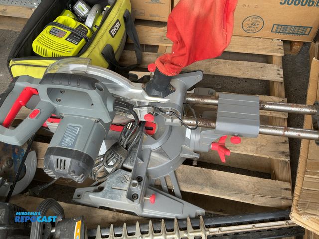 Lot 2-64341 - Performed Corded sliding miter saw with red adjustment knobs and a red dust bag