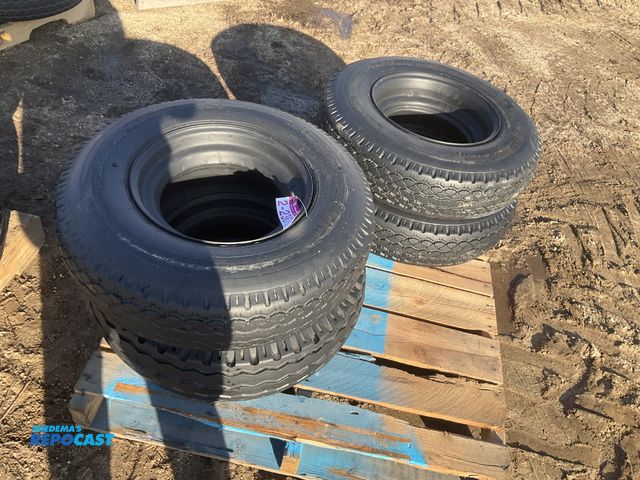 Lot 2-23679 - (4) 8-14.5 tires on steel mobile home style wheels, used