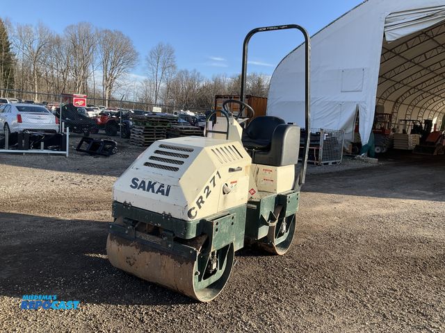 Lot 2-24164 - Sakai CR271 Gas Powered 1.5-ton class (approx. 3,200–3,265 lbs) ride-on, double-drum vibratory rolle...