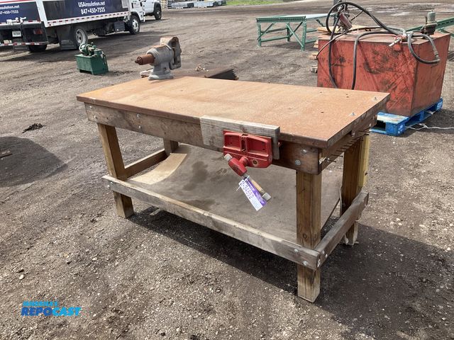Lot 2-34852 - Wood frame workbench 72” x 30” x 37-3/4”T, Olympia 5” vise mounted on one end, 1/8” steel over wood ...