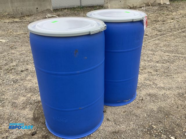 Lot 2-74439 - barrel (2) 55 gallon blue plastic barrels with removable lids and locking rings. Clean Inside.