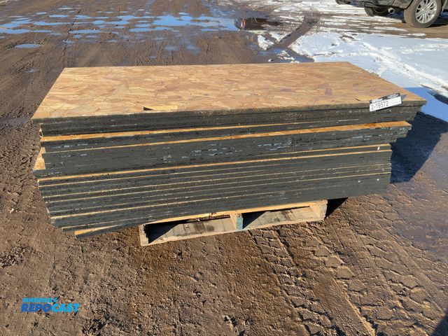 Lot 2-19572 - 22 OSB plywood sheets Boars with two handle looking holes through them on one side.