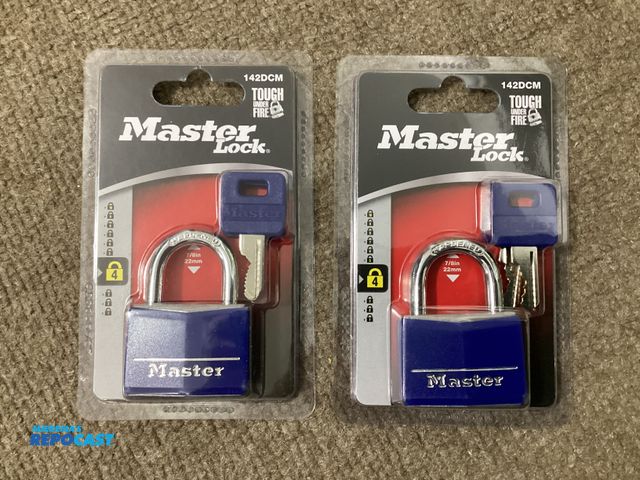 Lot 2-19211 - Two new MasterLock padlocks. 142DCM. Each lock comes with two keys.