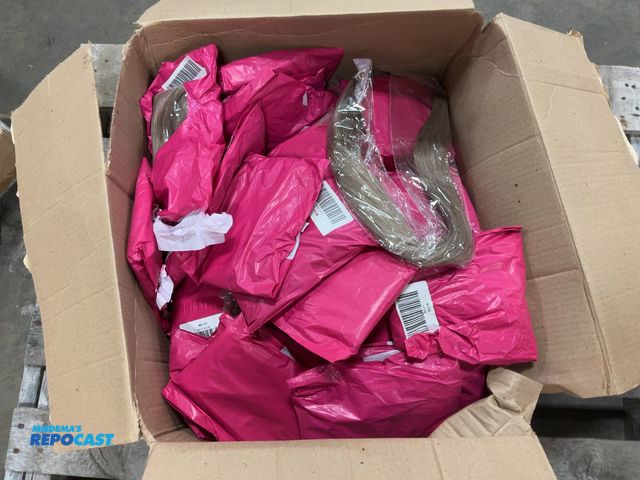 Lot 2-33591 - Box of hair extensions.
