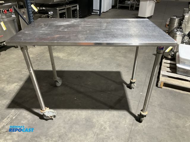 Lot 2-55092 - Stainless Steel 48” width x 36” height x 30” depth stainless steel table on 5” locking swivel caster...