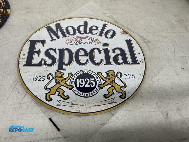 Lot 2-67042 - New Metal Sign Modelo beer sign 7.75 inches in diameter