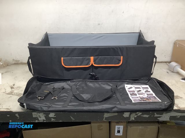 Lot 2-64381 - Black foldable 20”x43.5”x14”H dog car seat, comes with straps, an instruction manual, and a black ca...