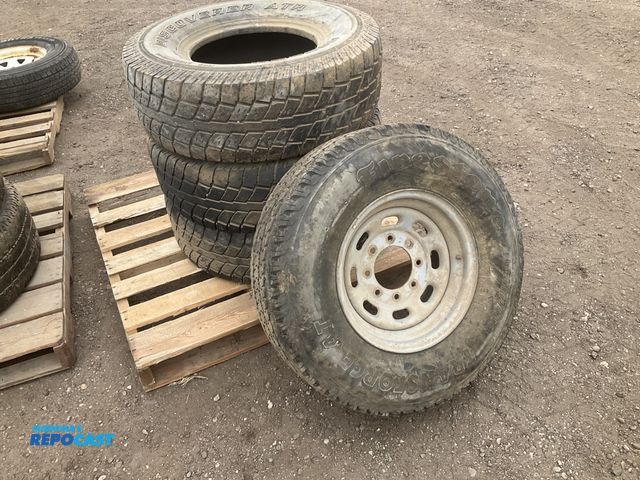 Lot 2-43272 - (1) 265/75R16 tire on a steel 8-bolt wheel, and (3) 285/75R16 tires without wheels (manufacturer dat...