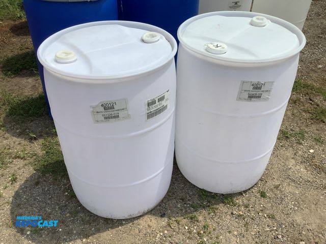 Lot 2-64409 - lot of 2 55 gallon white plastic barrels with 2 removable bungs, contained vinegar