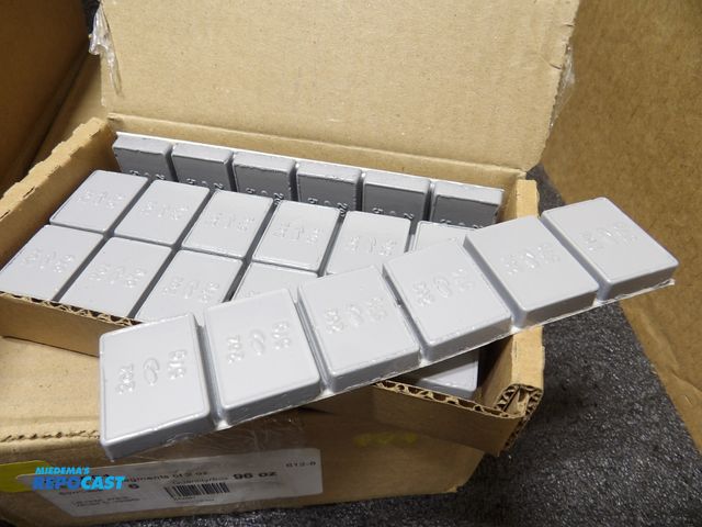Lot 2-53986 - lot of 576 2oz wheel weights, adhesive, 2 boxes with 6 packs each, 8 strips of 6 segments in each pa...